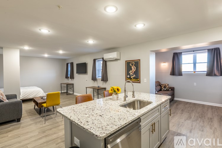 A kitchen with a granite countertop and a sink.