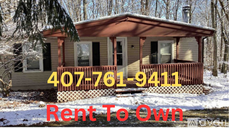 A house with the text "Rent To Own" in front of it.
