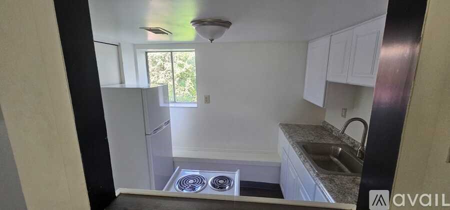 A kitchen with a window and a sink.
