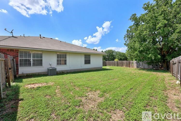 A house with a yard is for sale.