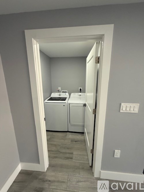 A laundry room with a washer and dryer.