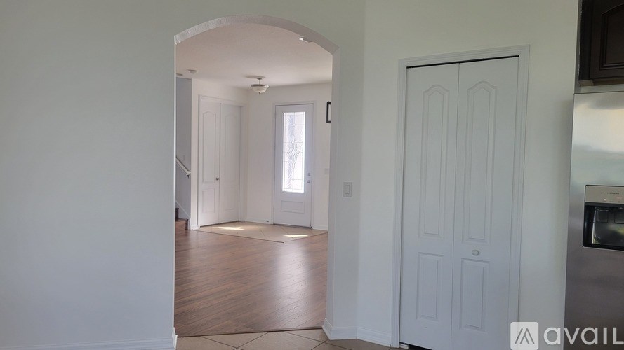 A white door is on the right side of the image.