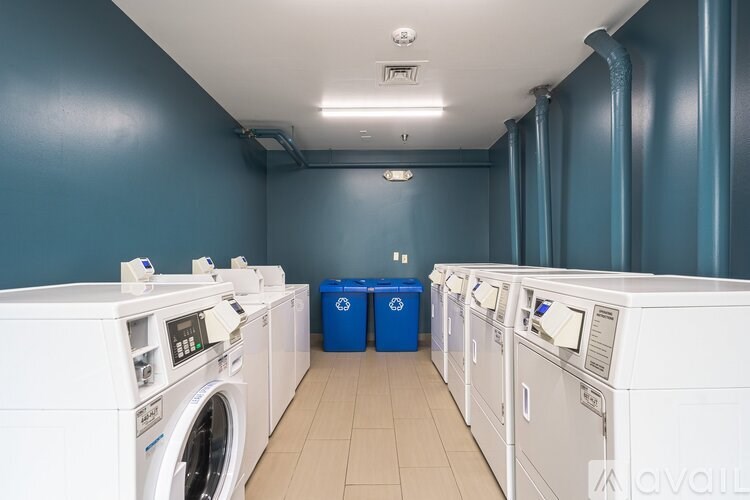 A row of washing machines in a laundromat.