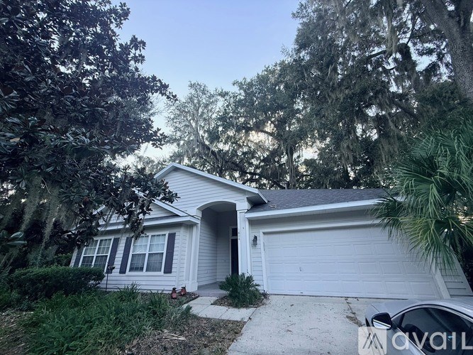 A bathroom with a tub and double sinks.