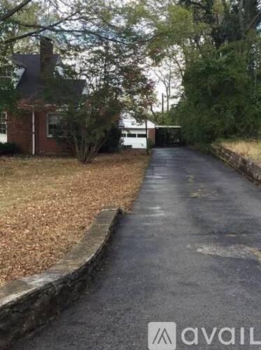 A residential street with houses on both sides.