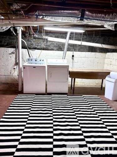 A black and white checkered rug is on the floor.