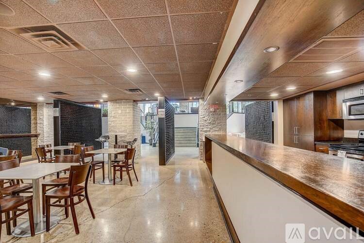 A modern kitchen with a dining table set up.