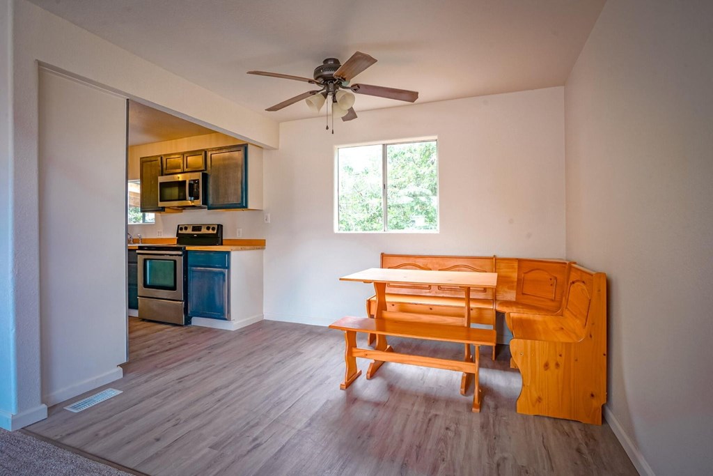 A kitchen with a blue oven and microwave.