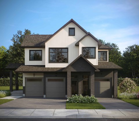 A modern house with a large front yard and two garages.