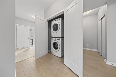 A laundry room with a washer and dryer in it.