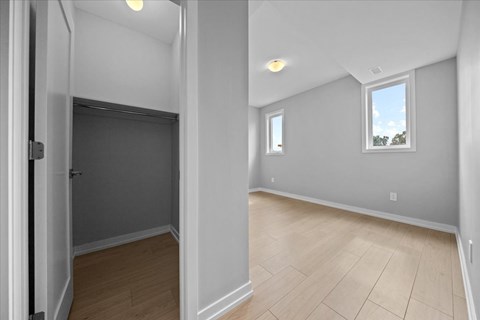 A room with a window and a door.