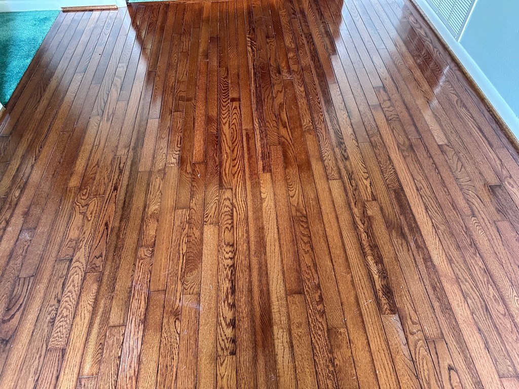 A wooden floor with a herringbone pattern is shown.
