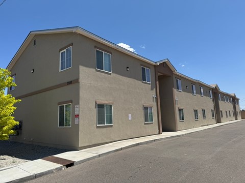 A building with a parking lot in front of it.