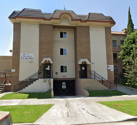 A building with a sign that says "FOR RENT" is shown.