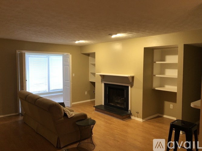 A living room with a fireplace and a couch.