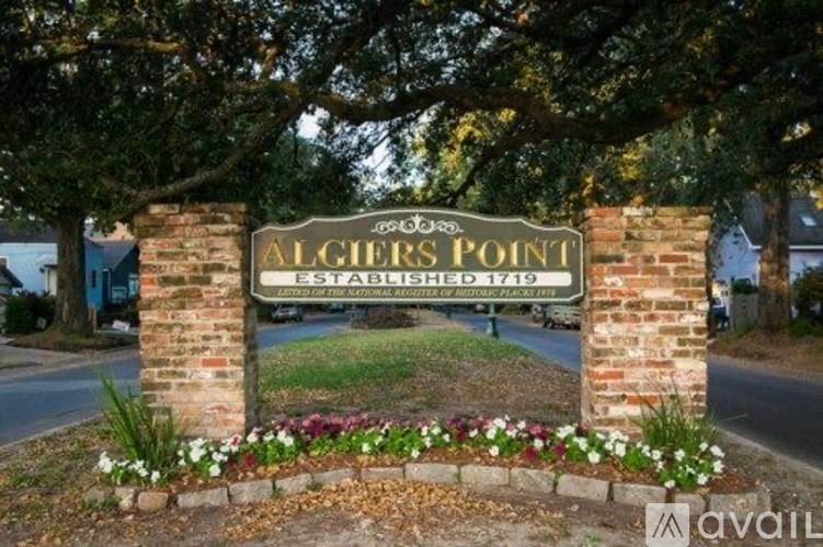 A sign that says Algiers Point Established 1719.