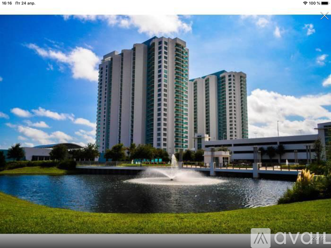 A modern building with a fountain in front of it.
