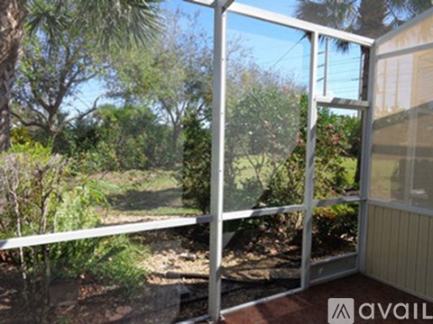 A glass door with a metal frame is open.