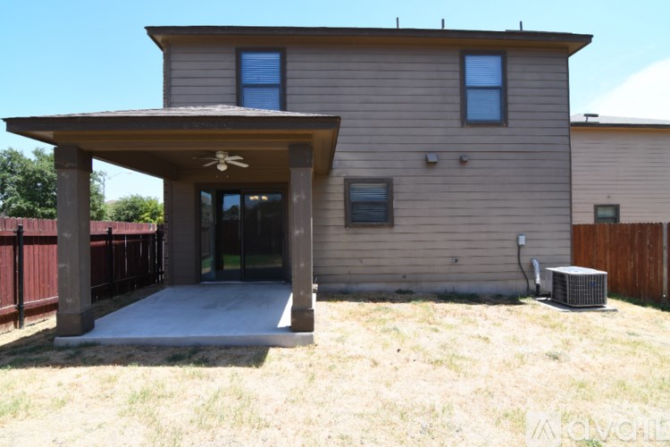 A house with a covered patio area.