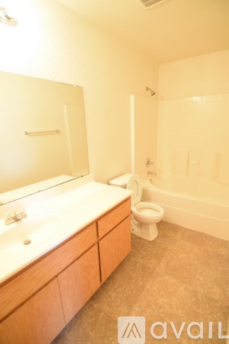 A bathroom with a sink, toilet and bathtub.