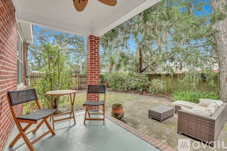 A patio with a table and chairs is shown.