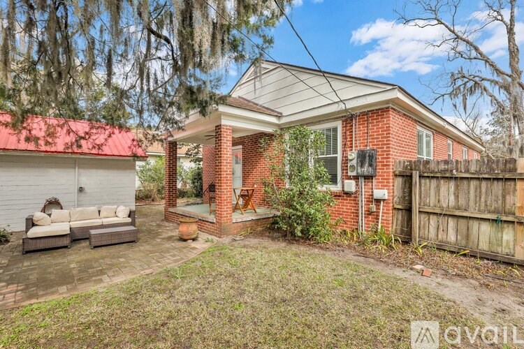 A house with a red roof and a white garage door.
