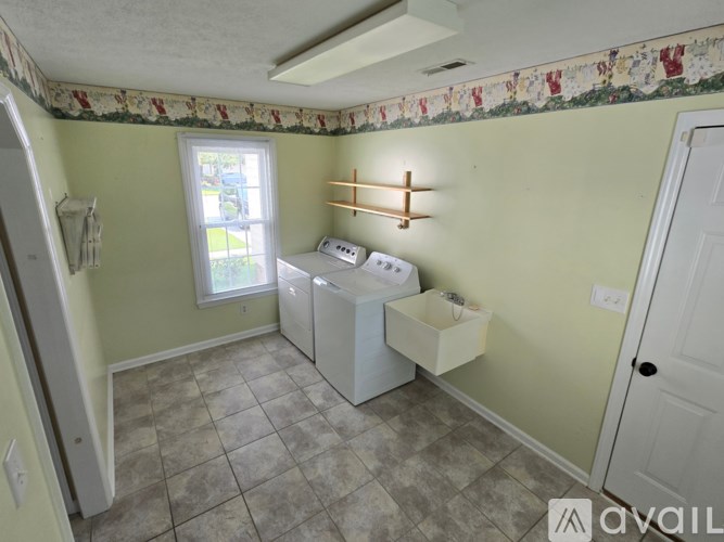 A laundry room with a washer and dryer.