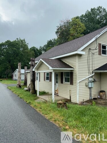 A house with a driveway in front of it.