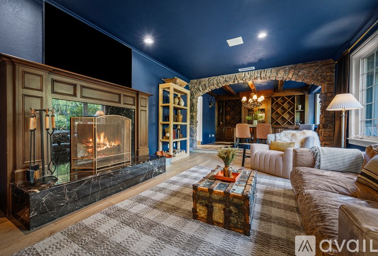 A living room with a fireplace and a couch.