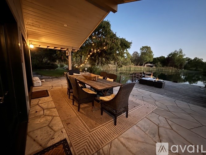 A bathroom with a glass shower stall and a white bathtub.