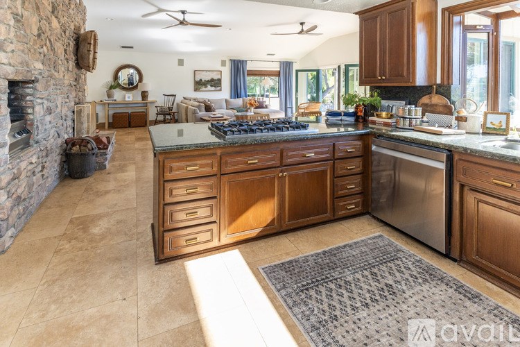 A dining area with a table and chairs is shown.