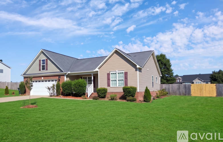 A house with a garage is available for sale.