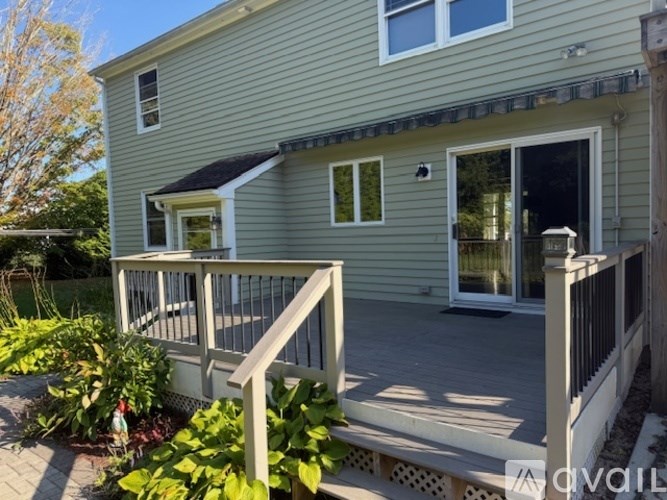 A house with a deck and a patio.