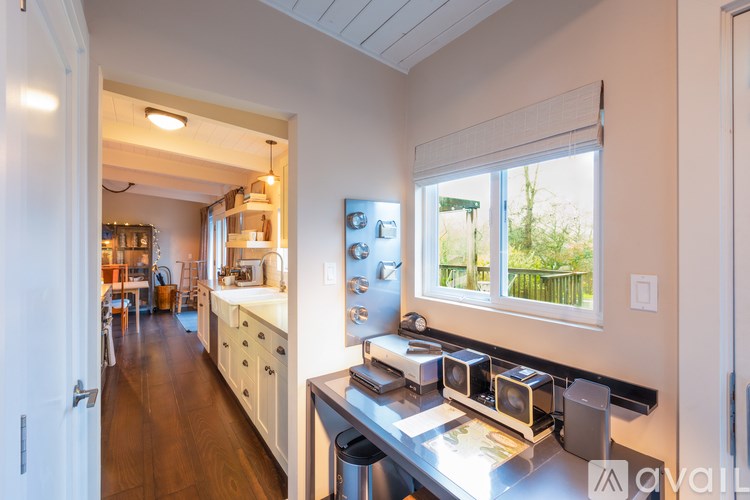 A kitchen with a sink, stove, and oven.