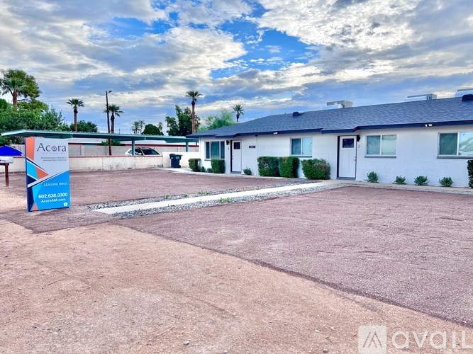 A vacant lot with a sign for Acera in the foreground.