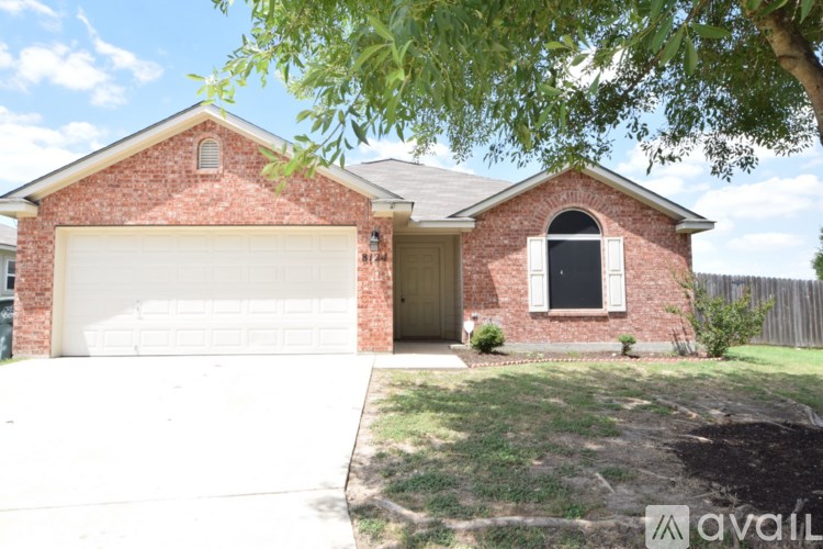 A house with a brick facade and a white garage door.