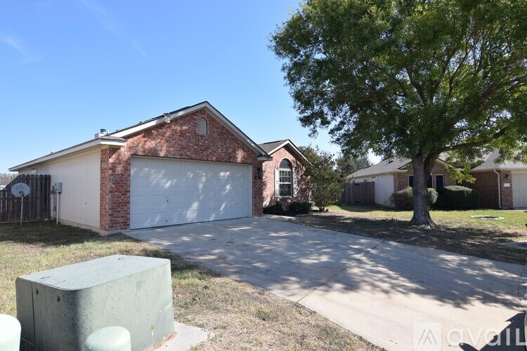 A house with a brick facade and a white garage door.