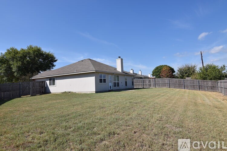 A house with a fence in front of it.