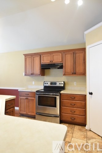 A room with a ceiling fan and a window.