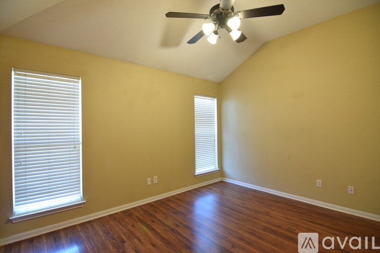 A bathroom with a toilet, sink, and bathtub.