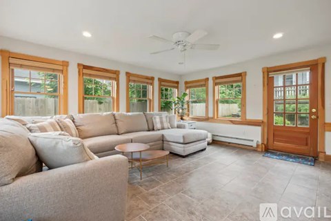 A spacious living room with a large sectional sofa and a coffee table.