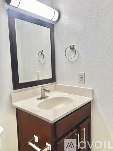 A bathroom sink with a mirror above it.