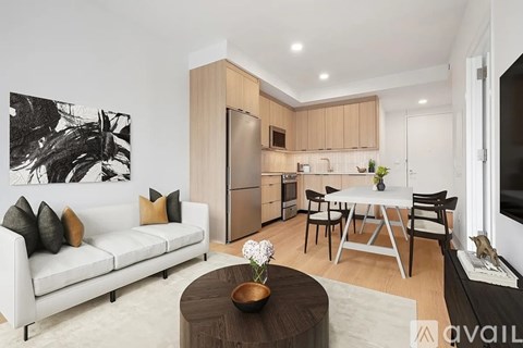 A modern living room with a white sofa and a coffee table.