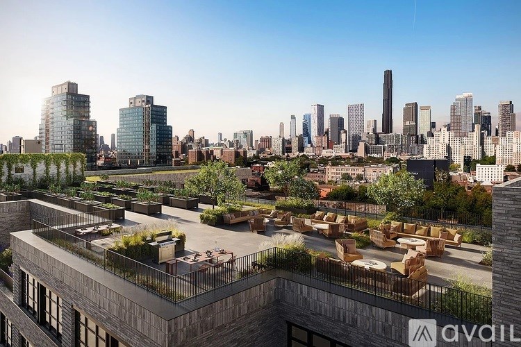 A modern cityscape with a building that has a green roof.