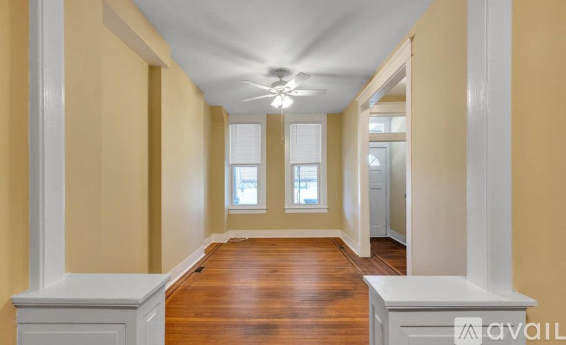 A long hallway with a bench on each side.