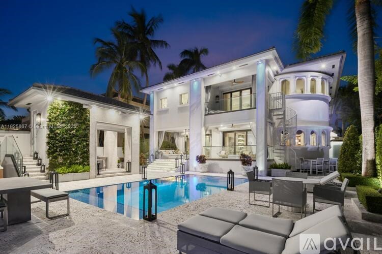 A modern house with a pool in the backyard.