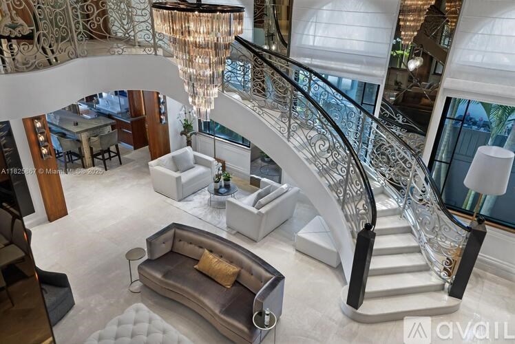 A living room with a staircase and a couch.