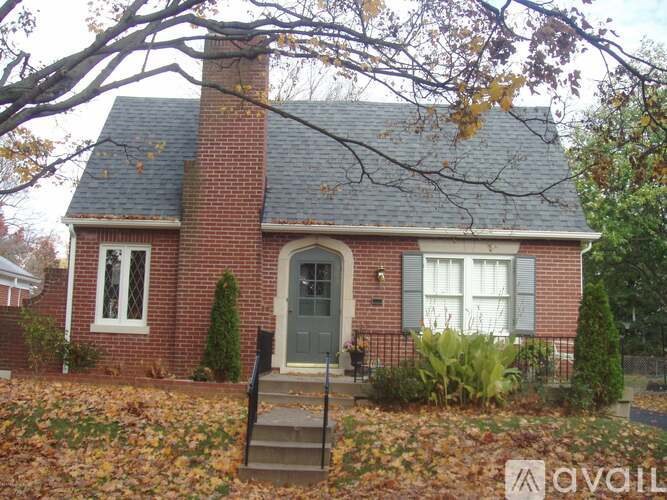 A house with a grey door and a grey front step.