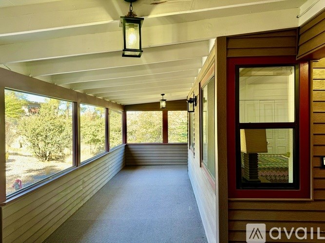 A long hallway with a lantern hanging from the ceiling.