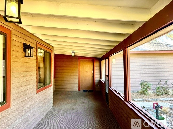 A long hallway with a door at the end.